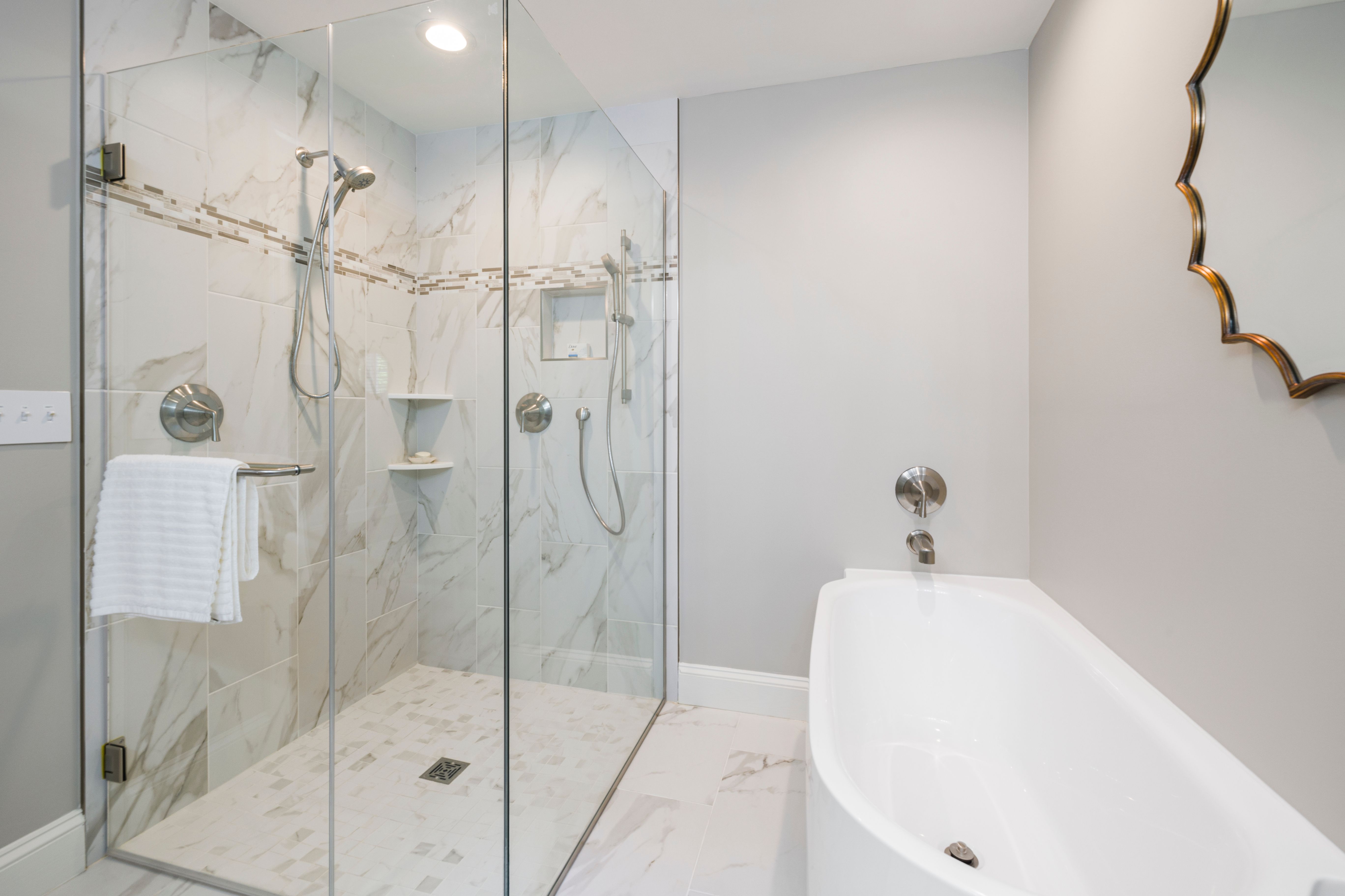 Arden primary bath with travertine and brass