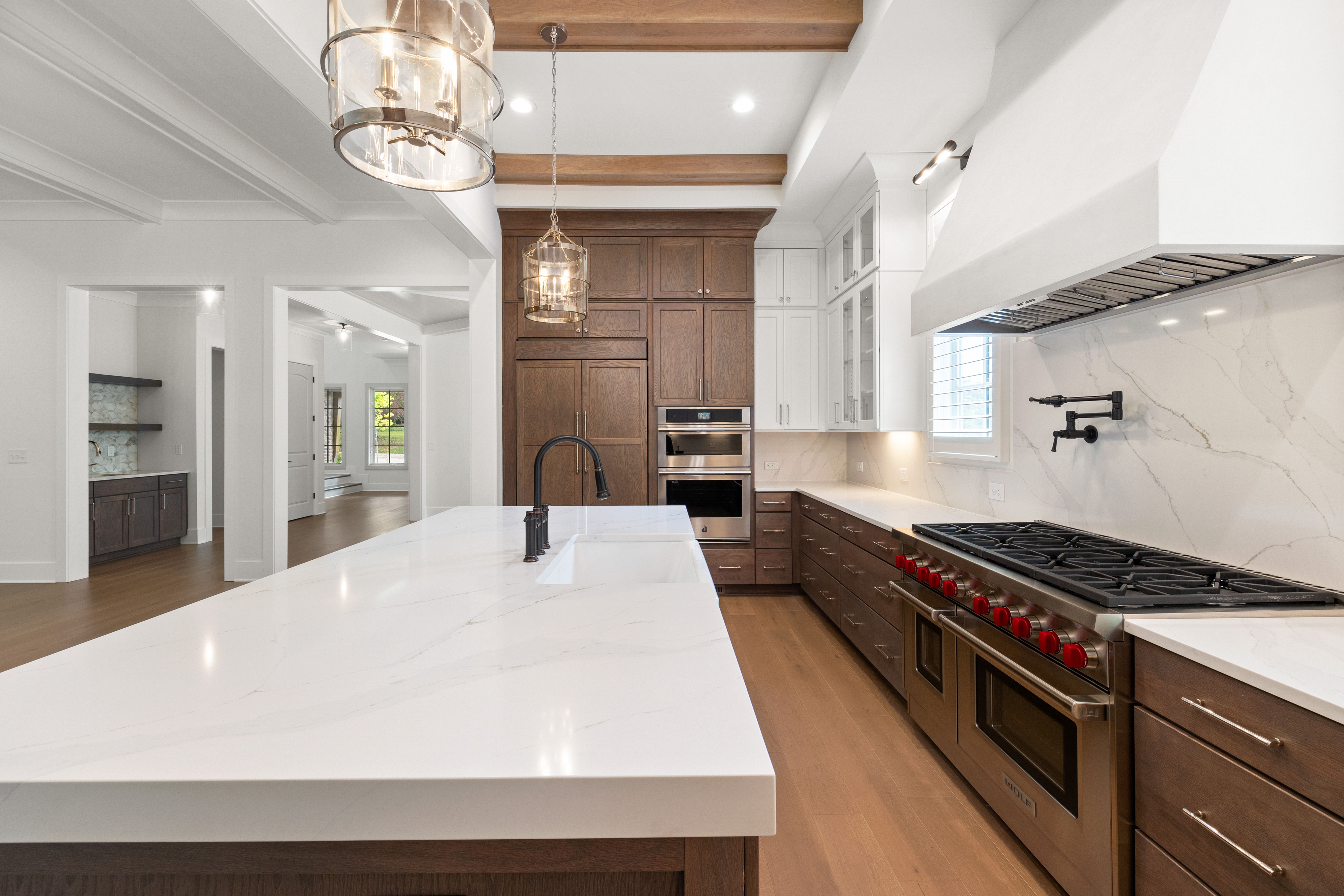 Lyon Crescent kitchen with marble island and walnut cabinetry